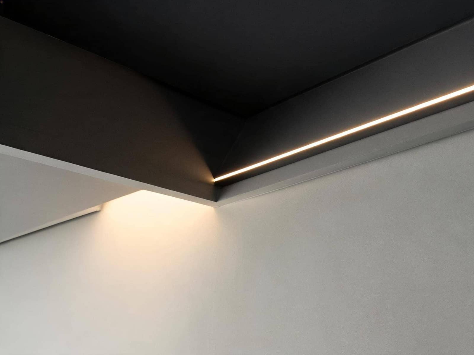 Interior linear cove lighting detail with custom gold leaf finish